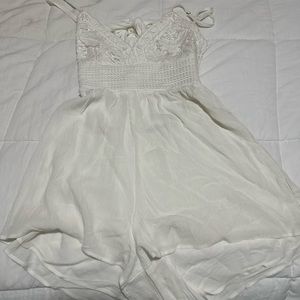 white romper with pattern on top half